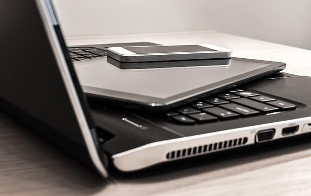 A marketer reviewing email campaign open rates and automation flows on a laptop dashboard