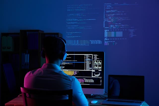 Marketer reviewing a marketing analytics dashboard with campaign metrics and conversion charts on screen